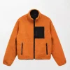 Sherpa Lined 8 Ball Orange Jacket featuring a warm sherpa lining and iconic 8 Ball patch design